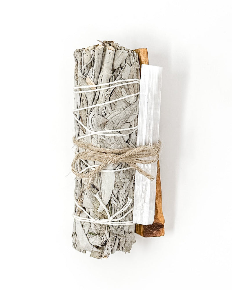 Bundle of white sticks tied with twine on a white background